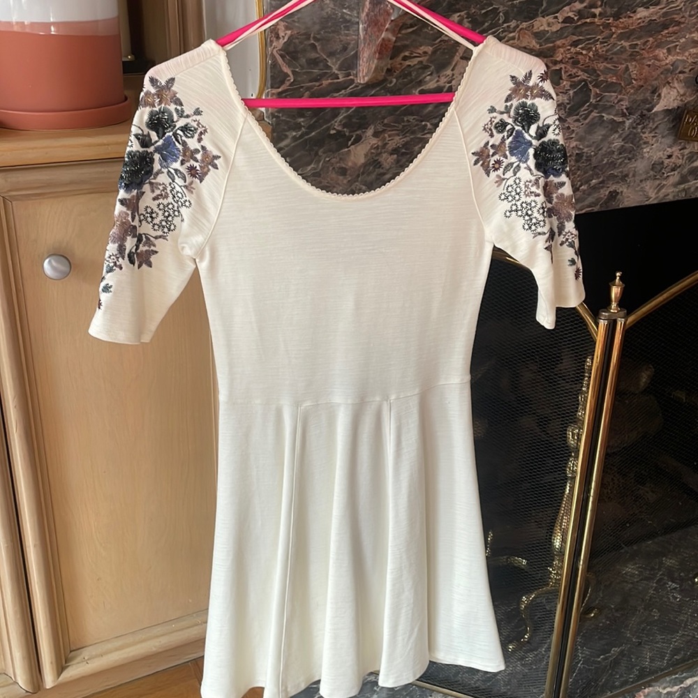 Brand new ivory/off white Free People mini with embroidered flower details!